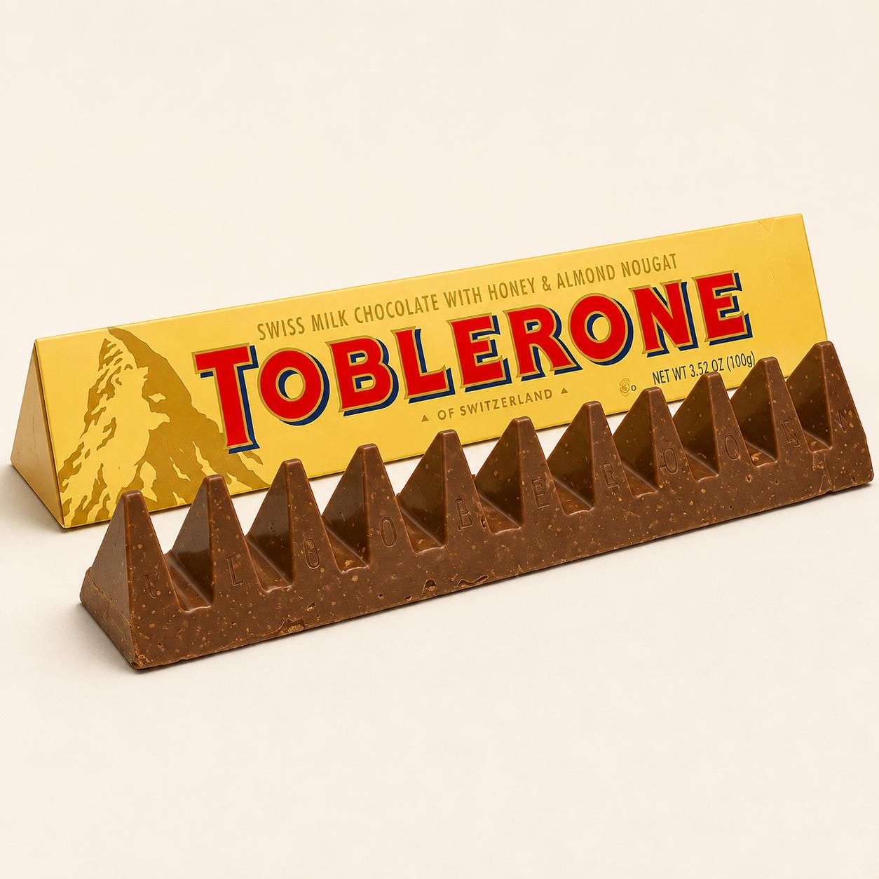 Toblerone 360g large milk chocolate bar with honey and almond nougat from Trelluna