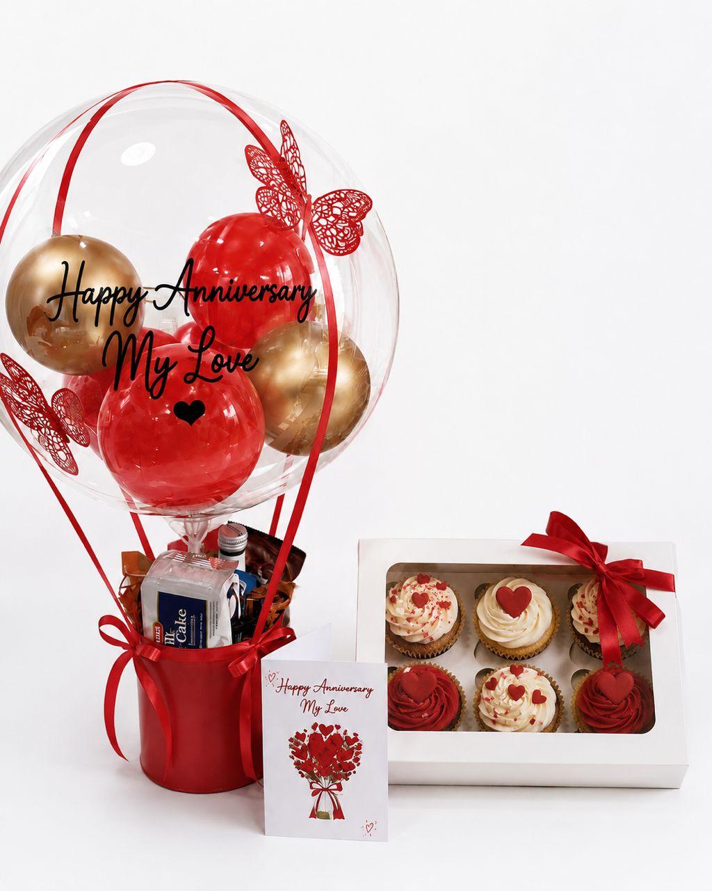 Hot air balloon treat with assorted treats, cupcakes and a card for a special celebration