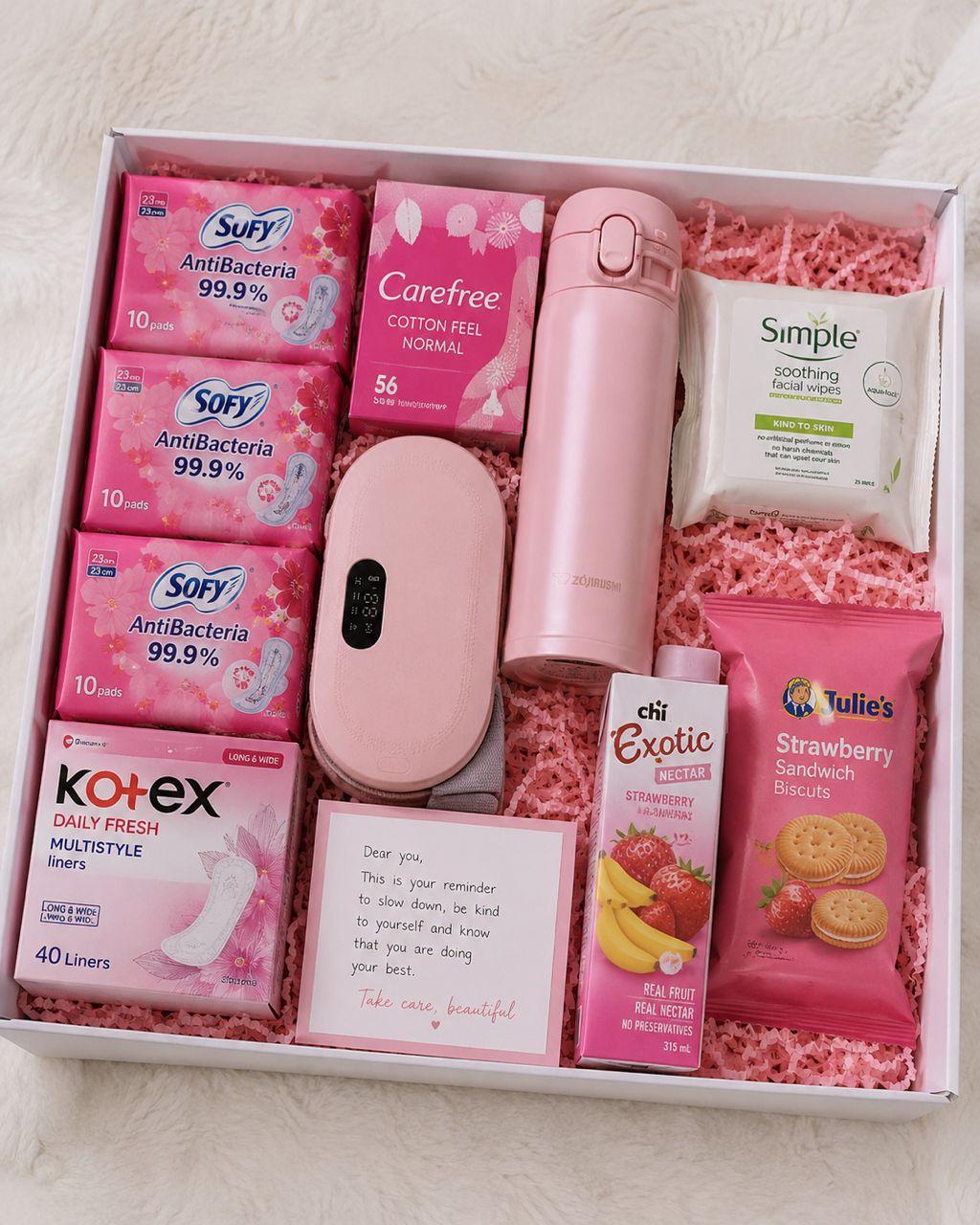 Period care gift box with sanitary pads, panty liners, wipes, menstrual pain relief belt, temperature flask, biscuits, juice and self-care note