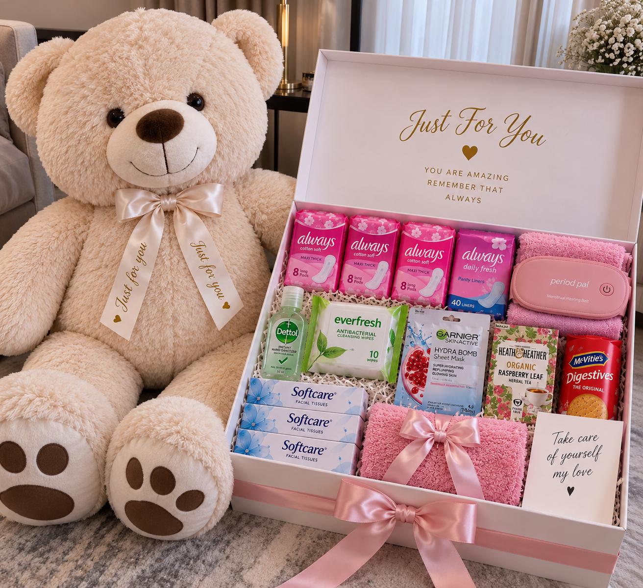Gift box with 100cm teddy, sanitary pads, panty liner, face towel, hand sanitizer, shower gel, face sheet, wipes, tissue and menstrual pain relief belt