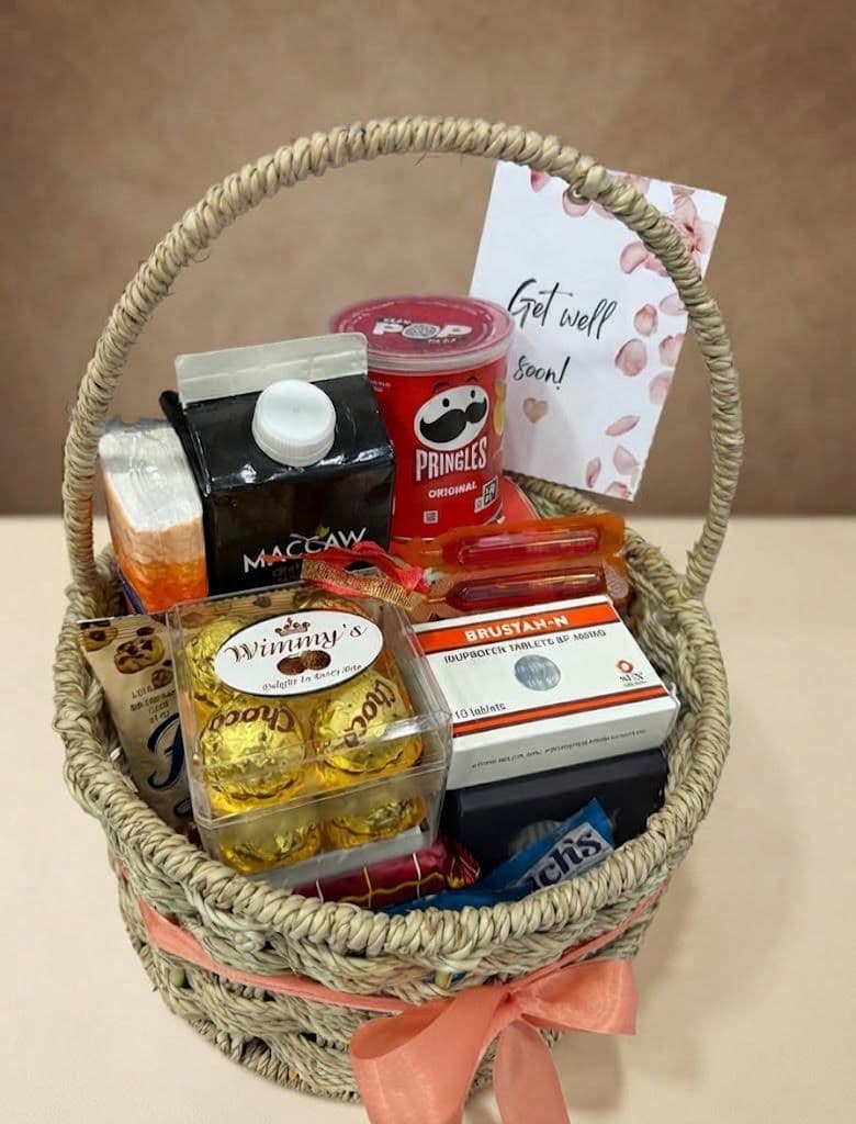 Care gift box with chocolate, juice, Pringles, cookies, herbal tea and milk