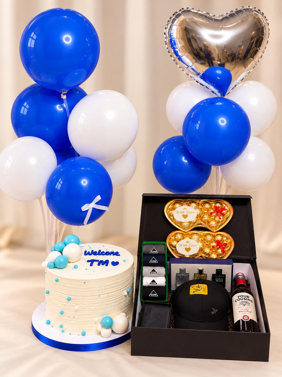 Birthday gift for him with tall cake, hamper containing cap, wallet, perfume set, socks and Four Cousins wine with two balloon stands