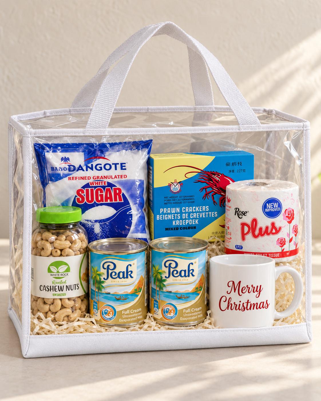 Christmas hamper with sugar, two tins of milk, cashew nuts, prawn crackers, toilet paper, customized mug and hamper bag