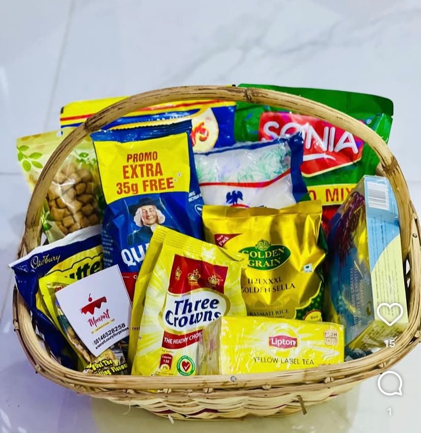 Christmas hamper with Basmati rice, Sonia tomato, Dangote sugar, prawn crackers, custard, oats, Lipton tea, milk, sweets and chin chin
