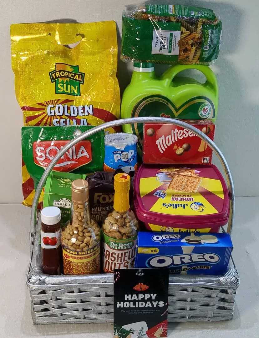 Christmas hamper with 5kg Basmati rice, groundnut oil, macaroni, cashew nuts, Oreo cookies, Maltesers chocolate, crackers, Fox’s cookies and fruit juice