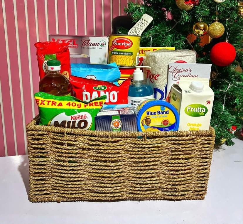 Christmas hamper with food flask, Golden Morn, Milo, milk, cornflakes, spaghetti, groundnut oil, fruit juice, custard and household essentials