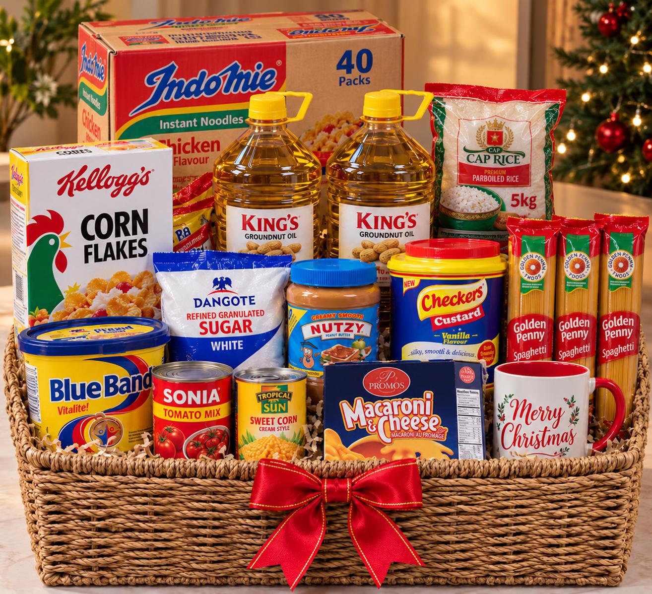 Christmas hamper with 5kg rice, groundnut oil, peanut butter, cornflakes, custard, spaghetti, carton of noodles, tomatoes, sweet corn and customized mug