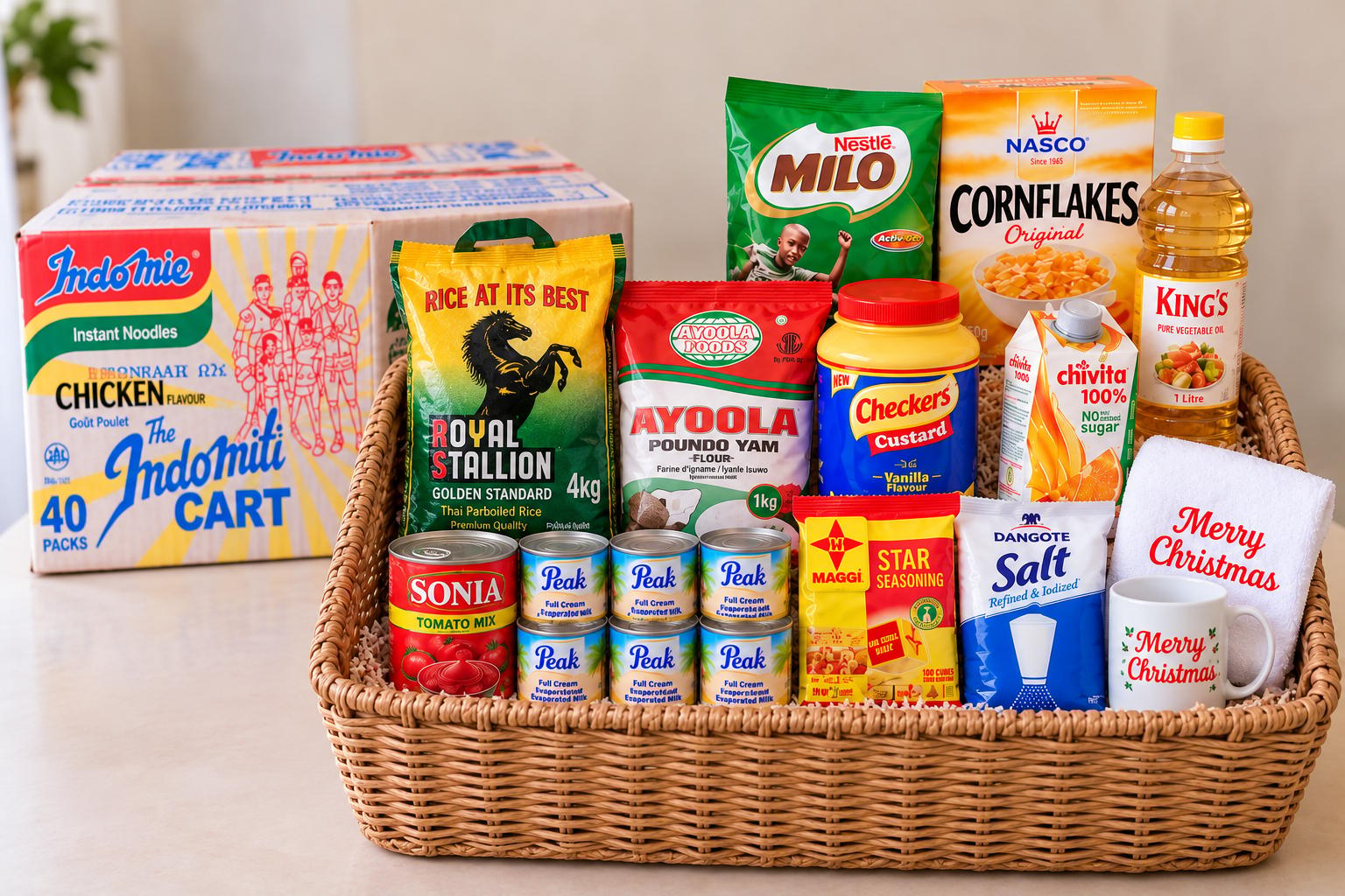 Christmas hamper basket with rice, groundnut oil, Poundo, carton of noodles, milk, Milo, custard, cornflakes, tomato paste, Chivita, customized mug and towel