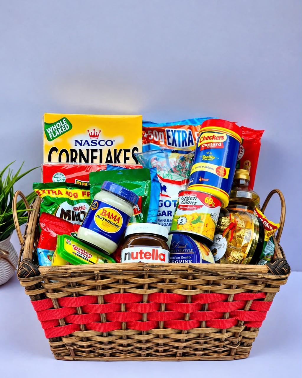 Christmas hamper with Golden Morn, Milo, milk, Nutella, corn flakes, sweet corn, butter, cookies, chocolate, custard, Bama, oats and spaghetti