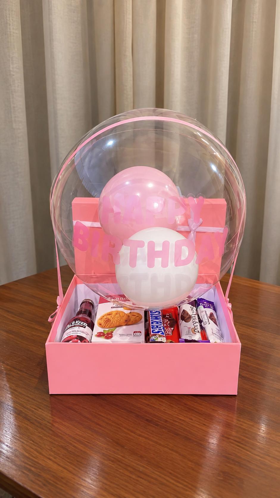 Birthday gift set with assorted chocolates, cookies, fruit wine and birthday card