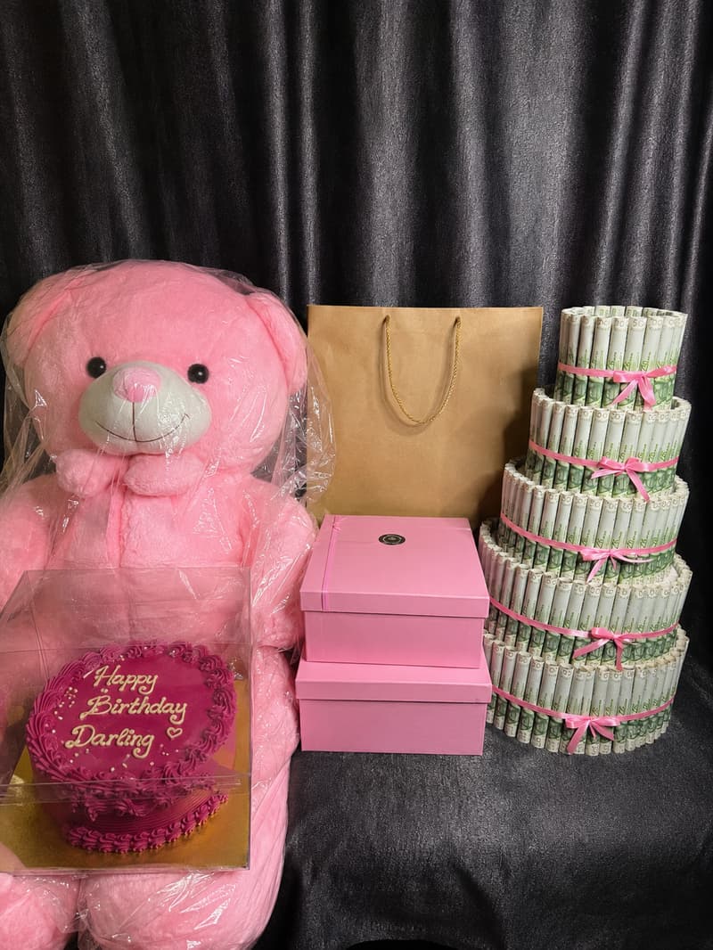 Surprise her with a luxury gift package featuring cake, human-size teddy, ₦100k money tower, fashion items, jewelry, Stanley cup and personalised gifts from Trelluna.